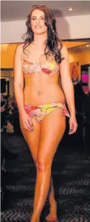  ?? A model shows off Busy Body’s swimwear ??