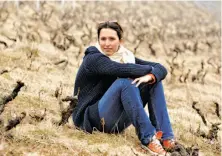  ?? Anne-Sophie Dubois / Sacred Thirst Selections ?? Anne-Sophie Dubois sits amid old vines. Her wines are often as reminiscen­t of Burgundy as of Beaujolais.