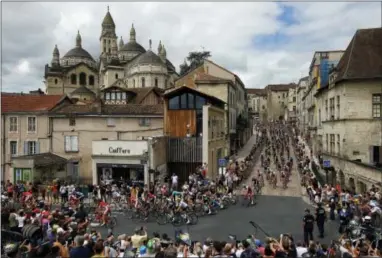  ?? PETER DEJONG — THE ASSOCIATED PRESS ?? The pack rides in Perigueux during the 10th stage of the Tour de France on Tuesday.