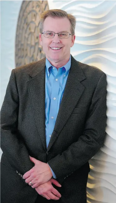  ?? BRUCE EDWARDS/ EDMONTON JOURNAL ?? David Stevens, standing in the boardroom on the 27th floor of Epcor Tower earlier this week, was previously CEO of El Paso Electric in Texas.