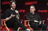  ?? Craig Barritt / Getty Images ?? Jason Reitman, left, and Ivan Reitman speak on stage during the ”Ghostbuste­rs: Afterlife” cast and filmmakers panel at New York Comic Con on Oct. 8 in New York City.