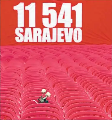  ?? Photo: REUTERS ?? Tribute: 11,541 red chairs were placed in Titova St, Sarajevo, on Friday to mark the 20th anniversar­y of the start of the Bosnian war. The Balkan country is still deeply divided with power shared between Serbs, Croats and Muslims.