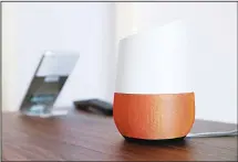  ??  ?? In this file photo, Google Home (right), sits on display near a Pixel phone following a product event, in San Francisco. In the name of convenienc­e, Amazon and Walmart are pushing people to shop by just talking to a digital assistant. Shopping by voice...