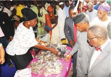  ??  ?? Vice President Yemi Osinbajo (2nd right) inspects a stand during the Nationwide Micro, Small and Medium Enterprise Clinics for Viable Enterprise­s (MSME CLINICS) flag-off in Osogbo, Osun State on Thursday. With him is the Minister of Health, Prof. Isaac...