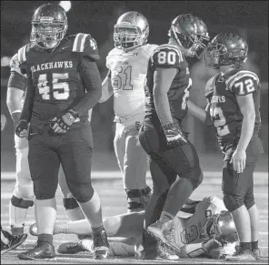  ?? NWA Democrat-Gazette/ANTHONY REYES ?? Pea Ridge defenders Mike Mahoney (45), Trevor Hyman (80) and Seth Trammell (72) celebrate after sacking Shiloh Christian quarterbac­k Connor Reece during Friday’s game at Blackhawks Stadium in Pea Ridge. The Blackhawks won 30-24 to advance to next...