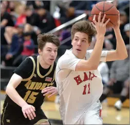  ?? Dan Watson/The ?? Signal Hart High’s Jaden Penberthy (11) drives under the basket against Knight High’s Daly Gallagher (15) at Hart High during a January 2020 matchup.