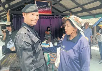  ??  ?? FAMILIAR FACE: Thai woman Des Klinklom, 62, crosses the border to Cambodia so often she is acquainted with the rangers in the area.