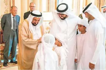  ?? WAM ?? Dr Shaikh Sultan receives Eid greetings at Al Badee Palace. He also received a delegation from Sharjah Police. Crown Prince Shaikh Sultan Bin Mohammad also received greetings.