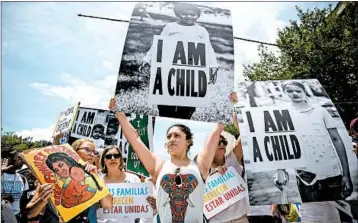  ?? EVELYN HOCKSTEIN/FOR THE WASHINGTON POST ?? Sufia Bassett, 32, of Bethlehem, Pa., originally from Ecuador, protests against family separation Sunday in Lafayette Square in Washington, D.C. Even with the end of separation­s, the task of reuniting parents and children remains.