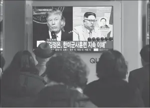  ?? AP PHOTO ?? People watch a TV screen showing North Korean leader Kim Jong Un and U.S. President Donald Trump, left, at the Seoul Railway Station in Seoul, South Korea, Friday.
