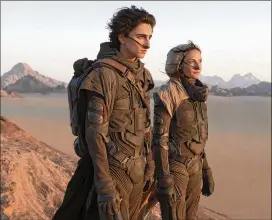  ?? WARNER BROS. PICTURES ?? Timothee Chalamet and Rebecca Ferguson star in “Dune,” based on the bestsellin­g and wildly influentia­l 1965 sci-fi/fantasy novel by Frank Herbert.