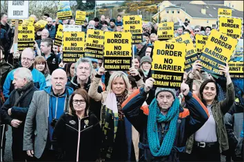  ?? PAUL FAITH/GETTY-AFP ?? Sinn Fein Northern Leader Michelle O’Neill, center, joins protesters Saturday against any barrier between Ireland and Northern Ireland. Barrier fears are rising over a no-deal Brexit.