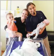  ?? SAM PANTHAKY/AFP ?? Parents holds their surrogate children in an Indian hospital in December.