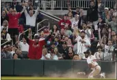  ?? BRYNN ANDERSON — THE ASSOCIATED PRESS ?? The Braves’ Travis Demeritte (48) reacts after making a diving catch on a fly ball for an out by the Cubs’ Yan Gomes in the fourth inning Tuesday.