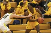  ?? NEWS-HERALD FILE ?? Brush’s Antwone Woolfolk is guarded by Riverside’s Brett Fulton on Jan. 22.