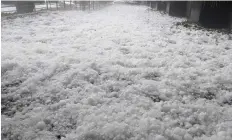  ?? Reuters | ?? A CARPET of golf ball-sized hail on a street after a hailstorm in Canberra, yesterday.