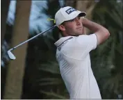  ?? MARTA LAVANDIER — THE ASSOCIATED PRESS ?? Austin Eckroat leads the Cognizant Classic by one shot but still needs to complete 11holes today after Sunday's washout.