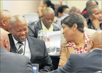  ?? Picture: EUGENE COETZEE ?? INSIDE JOKE: Nelson Mandela Bay deputy mayor Bicks Ndoni, left, and speaker Maria Hermans share a light moment at the Human Settlement­s Developers Consultati­ve Workshop at the Nelson Mandela Bay Stadium yesterday