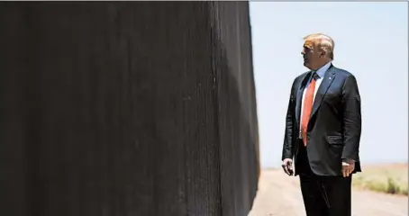  ?? EVAN VUCCI/AP ?? President Donald Trump tours a section of border wall in San Luis, Arizona, last Tuesday. A federal appeals court has ruled against his administra­tion.