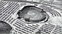  ?? MILWAUKEE SENTINEL ?? Milwaukee County Stadium is shown from the air on April 7, 1970, the Brewers' first opening day at the ballpark — without a roof. This photo appeared in the Milwaukee Sentinel on April 8, 1970.