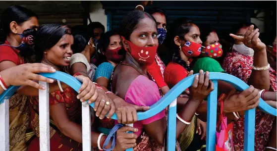  ??  ?? SUCCESSFUL DRIVE: Women wait to get inoculated outside a vaccinatio­n centre in Kolkata on Tuesday (31)