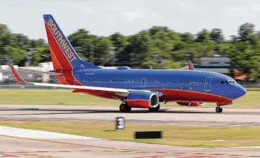  ?? Tony Gutierrez / Associated Press ?? Southwest Airlines will start service in the major airports in Houston, Chicago and Miami.