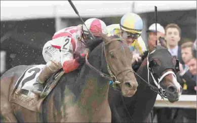  ?? BARBARA D. LIVINGSTON ?? Cloud Computing (left) wins the Preakness. He is the first classic winner for Maclean’s Music.