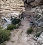  ?? KANE COUNTY SEARCH AND RESCUE (VIA AP) ?? This Oct. 2 photo released by Kane County Search and Rescue shows the vehicle driven by an older Texas couple who were rescued severely dehydrated but alive after they were stranded six days on a desolate dirt road in southern Utah.