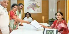  ?? ?? BJP State president D. Purandeswa­ri, accompanie­d by Union Minister V.K. Singh, submitting her nomination papers to Returning O‰icer K. Madhavilat­ha in Rajamahend­ravaram on Friday.