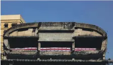  ?? AFP ?? The Lebanese flag decorates the dilapidate­d building