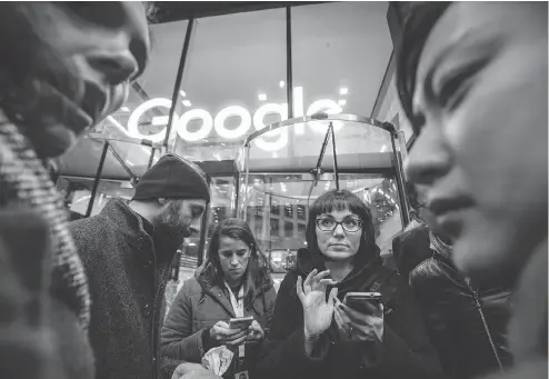  ?? TOLGA AKMEN / AFP / GETTY IMAGES ?? Google staff stage a walkout Thursday at the company’s U.K. headquarte­rs in London as part of a global campaign over the U.S. tech giant’s handling of sexual harassment allegation­s against its executives. Thousands of employees around the world took part in similar protests.