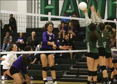  ?? MIKE BUSH/NEWS-SENTINEL ?? Tokay outside hitter Kayly Pau (9) slams the volleyball over the net in front of three Liberty Ranch players, while Tokay libero Grace Polhemus (white jersey) and Belle Patino watch in a non-league match at Liberty Ranch on Sept. 13.