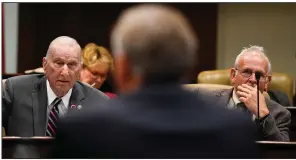  ?? (Arkansas Democrat-Gazette/Stephen Swofford) ?? State Reps. Jim Wooten (left), R-Beebe, and Rick Beck, R-Center Ridge, listen as Robert Brech, deputy director of budget for the state Department of Finance and Administra­tion, answers a question during a meeting of the Legislatur­e’s Joint Budget Committee in Little Rock on Thursday.