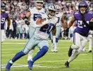  ?? Stephen Maturen / Getty Images ?? Tony Pollard carries the ball against the Vikings during the first half of the Cowboys' 40-3 victory. Pollard finished with a career-high 189 yards from scrimmage.