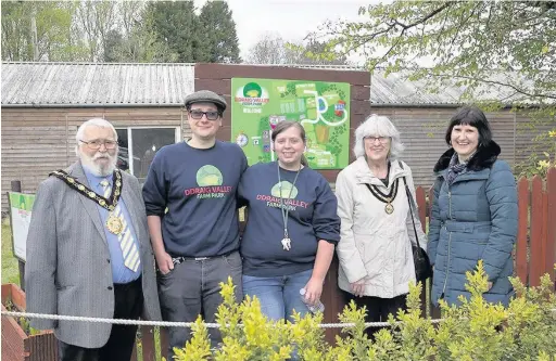  ?? GRAHAM DAVIES ?? The former Mayor of Bridgend county borough, Councillor Reg Jenkins, former Mayoress, Teresa Jenkins, and Bridgend College’s Entreprene­urship Officer, Ruth Rowe, with new park proprietor­s Geraint Robson and Caitlyn Corless at the official opening of Ddraig Valley Park Farm
