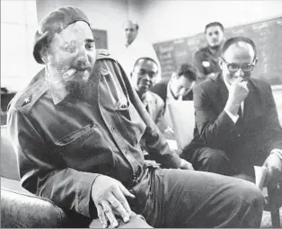  ?? Alan Oxley Getty Images ?? ON TOP A gloating Castro in 1961 during negotiatio­ns over prisoners captured by Cuban forces in the Bay of Pigs invasion. The conf lict allowed him to persuade Cubans the U.S. meant them harm.