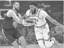  ?? GARY A. VASQUEZ/USA TODAY SPORTS ?? Timberwolv­es center Karl-Anthony Towns moves the ball against Clippers center Ivica Zubac at Crypto.com Arena.
