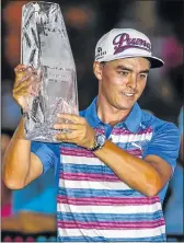  ?? Picture: EPA ?? SECOND TITLE: American Rickie Fowler holds up his trophy after winning the Players Championsh­ip in a sudden death playoff at TPC Sawgrass in Florida