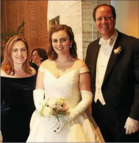  ??  ?? New York University student Sydney Jennings Cohn, of Villanova, gets “backing” from her parents, Lea and Matt, to become a debutante.