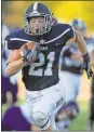  ??  ?? Steven Eckhoff / RN-T
Berry’s Adam Hubert runs for a touchdown Saturday during the Vikings’ 41-3 win against Sewanee