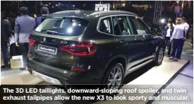  ??  ?? The 3D LED taillights, downward-sloping roof spoiler, and twin exhaust tailpipes allow the new X3 to look sporty and muscular.