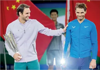  ??  ?? Shanghai Masters winner Roger Federer and second-placed Rafael Nadal last month in Shanghai. Federer and Nadal said they welcome innovation in tennis but warned the game's administra­tors not to tamper too much with the current format - AFP