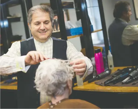  ?? DAX MELMER ?? Antoine Greige, owner of Antoine Griege Salon, works with a client on Thursday. To ensure his clients’ safety, the salon is taking fewer clients at one time and refusing to book clients who are sick or have recently returned from internatio­nal travel.