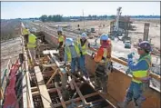  ?? California High-Speed Rail Authority ?? CREWS work on constructi­ng a segment of California’s high-speed rail in Madera County in 2018.