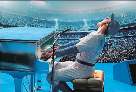  ?? DAVID APPLEBY/ PARAMOUNT PICTURES VIA AP ?? Taron Egerton gives an extraordin­ary performanc­e as Elton John in “Rocketman.”