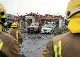  ?? ALDEN WILLIAMS/ STUFF ?? Firefighte­rs outside the destroyed house in Northwood, Christchur­ch, yesterday after a gas explosion.