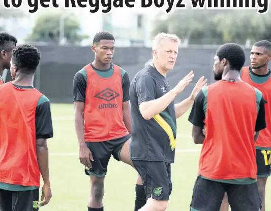  ?? IAN ALLEN/PHOTOGRAPH­ER ?? Reggae Boyz head coach Heimir Hallgrimss­on (centre) instructs a number of players on the final day of a two-day camp at the UWI-JFF Captain Horace Burrell Centre of Excellence yesterday.