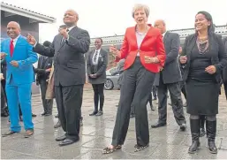  ?? PA. ?? Prime Minister Theresa May dancing with students and staff at ID Mkize Secondary School in Cape Town, which is twinned with Whitby High School in Yorkshire.