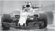  ??  ?? Lance Stroll steers his car during qualifying at Monza on Saturday.