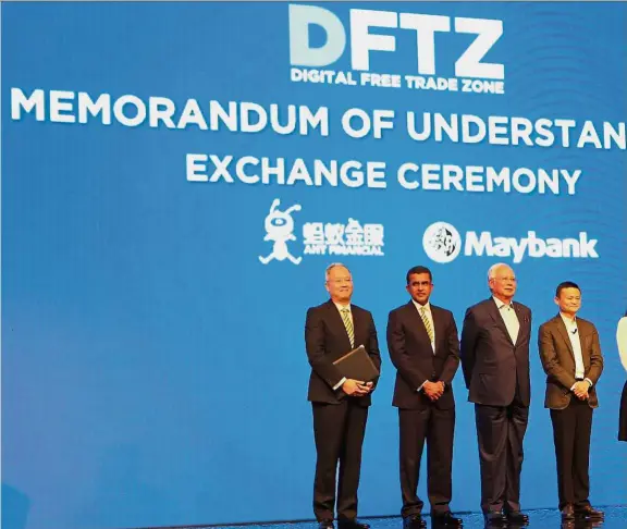  ??  ?? Joint force: Najib with (from left) Maybank group chief strategy officer Michael Foong, group technology officer Mohd Suhail Amar Suresh, Ma, Ant Financial Services Group chairman Lucy Peng and senior vice-president Douglas Feagin at the Digital Free...